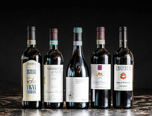 five red wine bottles