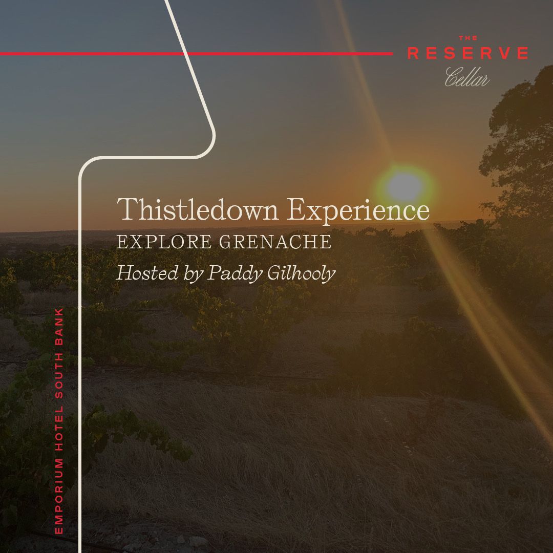 Sunset over winery with event graphic overlay