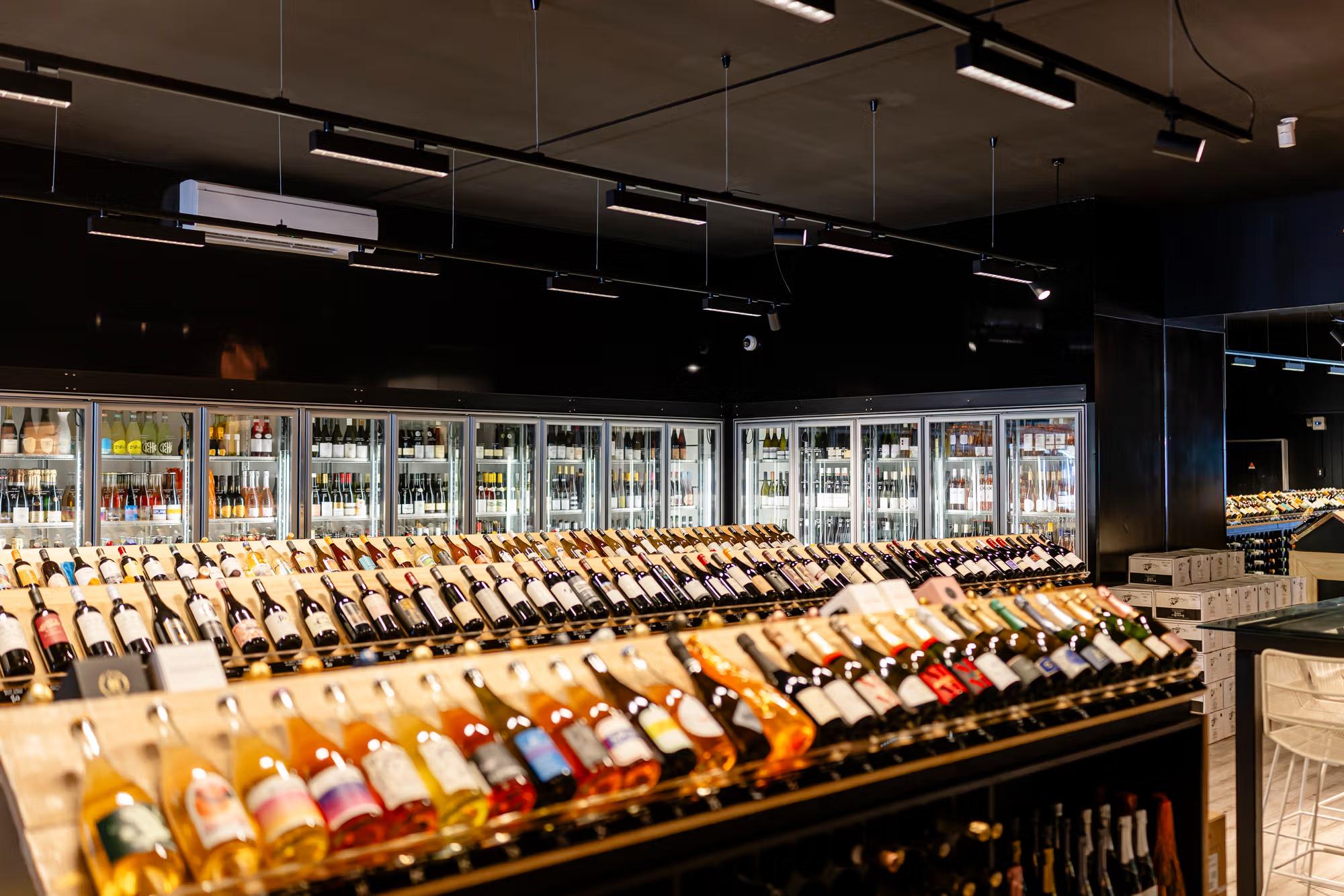 Wine racks and fridges inside wine store