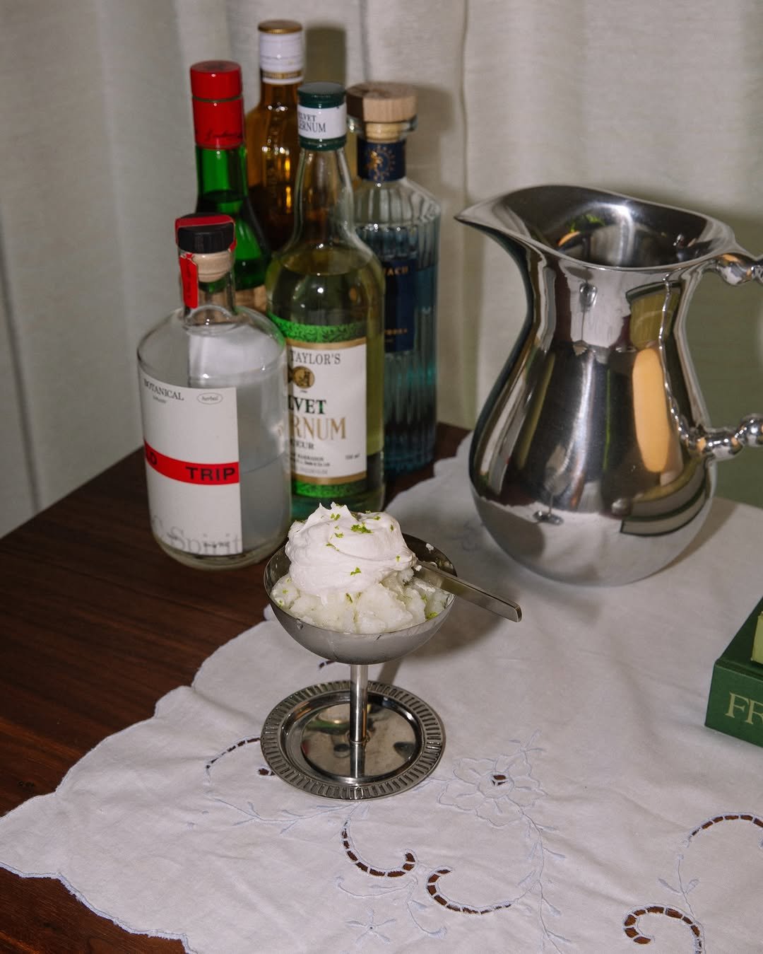 Coconut key-lime pie inspired sorbet featuring Field Trip Botanical Spirit in a stemmed, stainless steel ice cream cup.