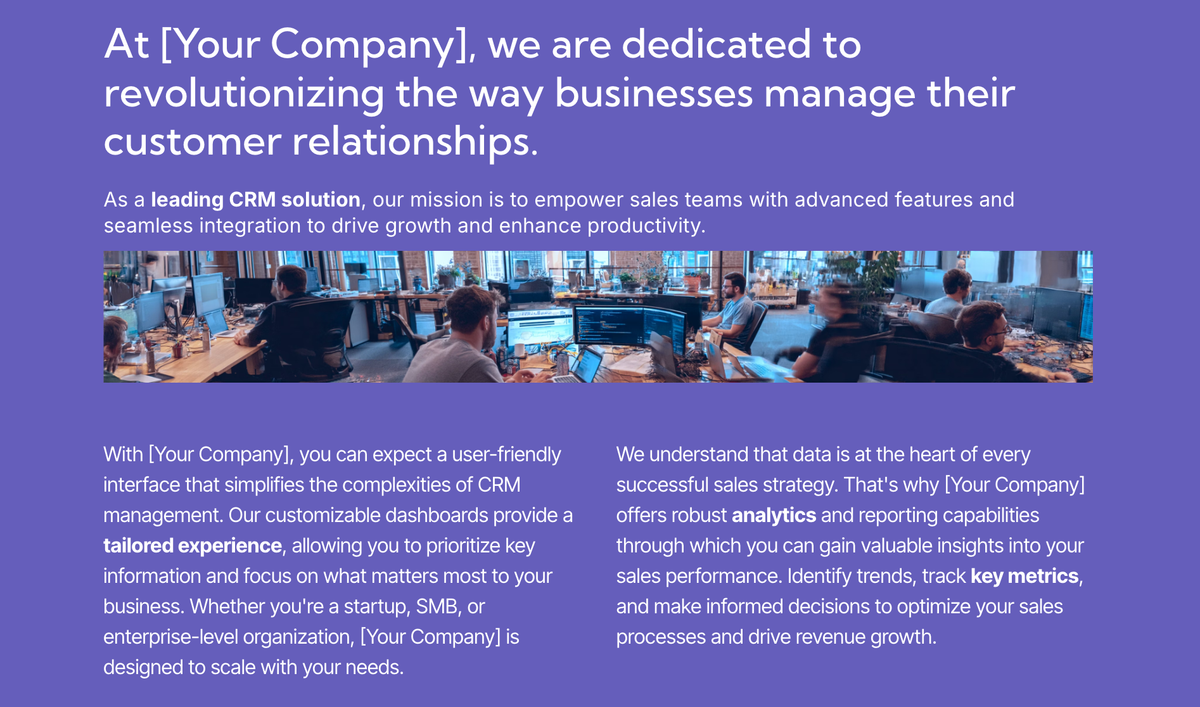 People working on computers in a modern open-plan office.