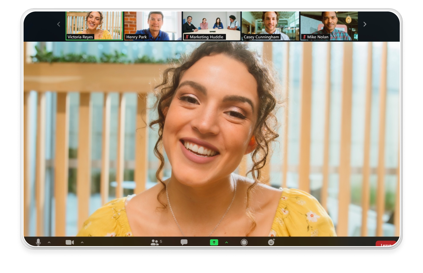 a woman is smiling in front of a group of people including mike nelson