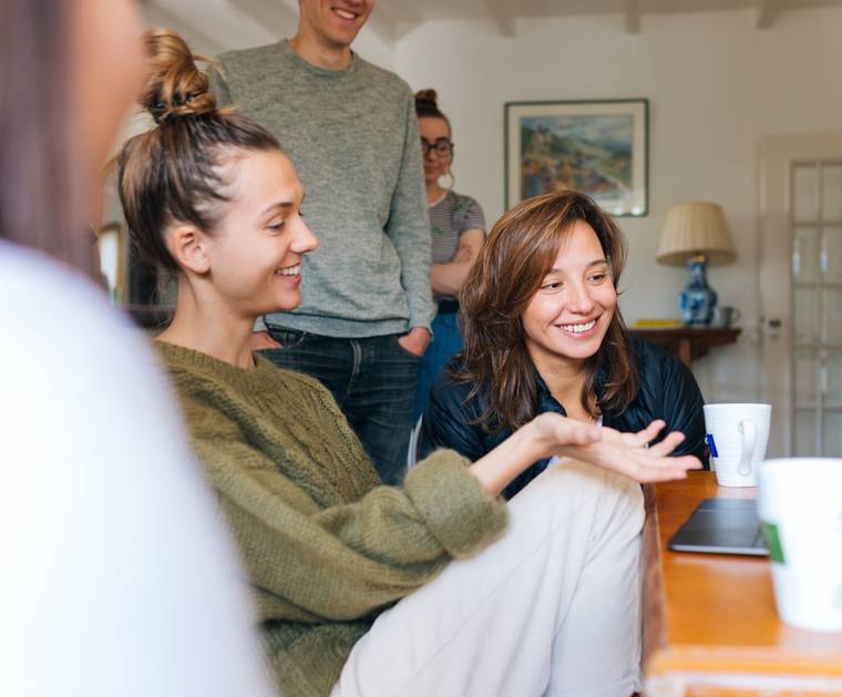 People smiling while collaborating