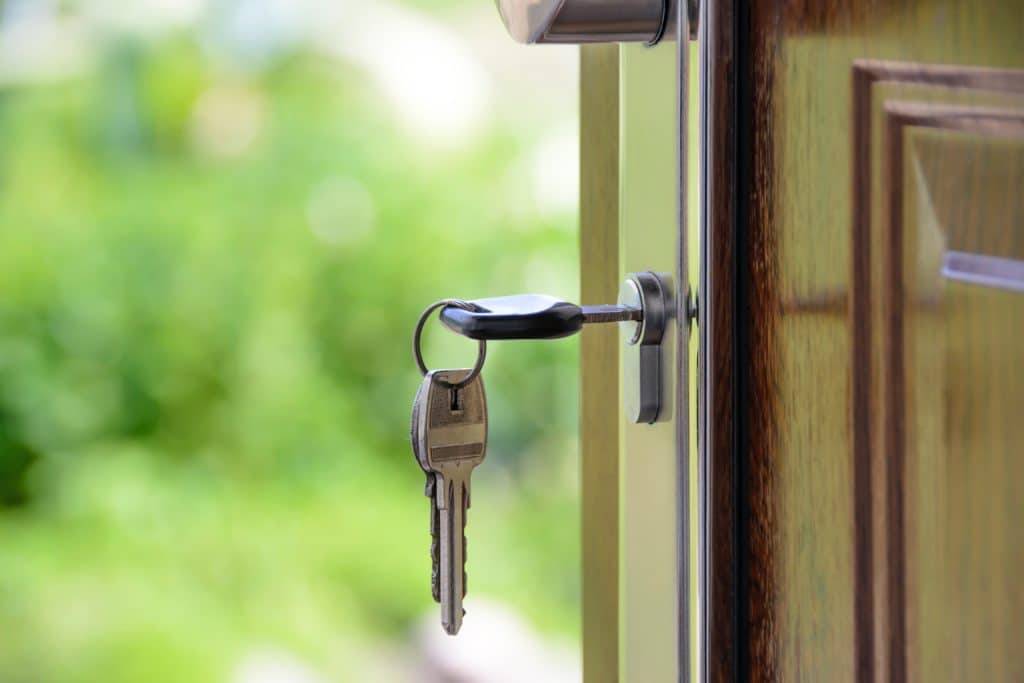 key in lock - symbolising real estate deal closed