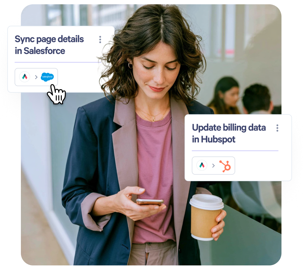 Woman looking at phone, with overlay cards showing "Sync page details in Salesforce" and "Update billing data in Hubspot."