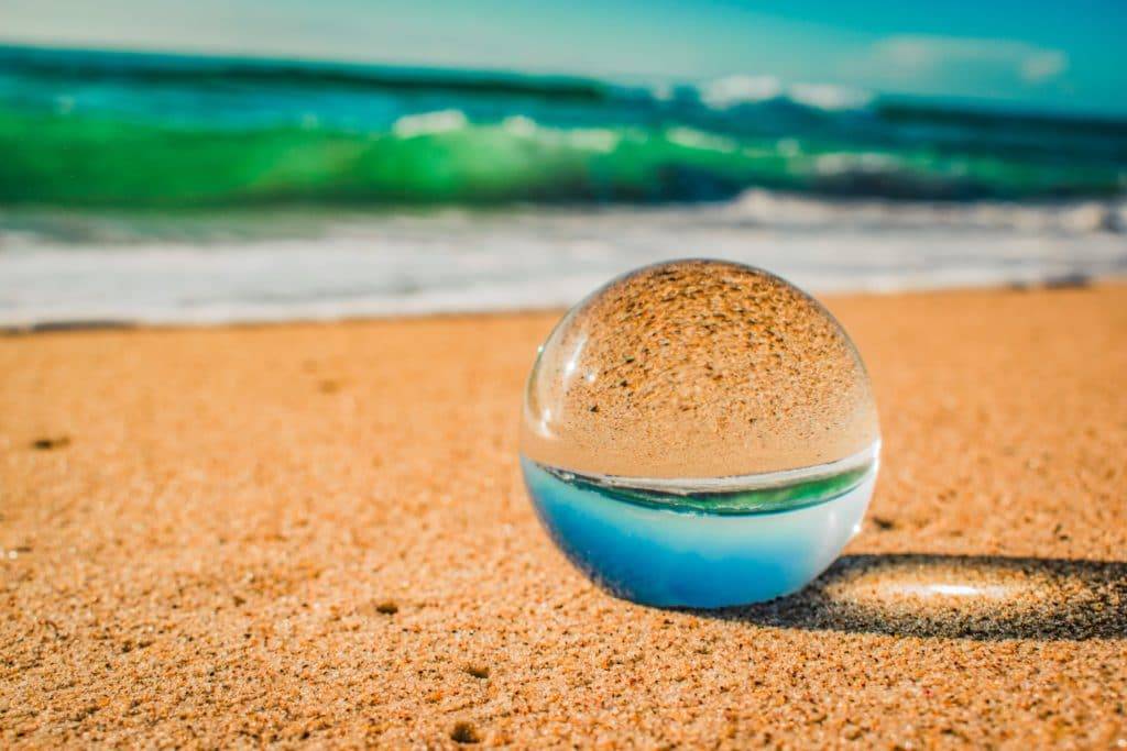 clear sphere at beach - symbol of looking out into the future