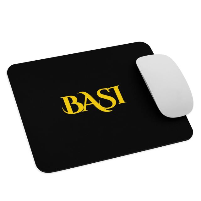 Black BASI mouse pad with a white mouse, angled view