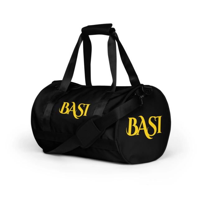 Black barrel gym bag with gold BASI wordmarks, angled view