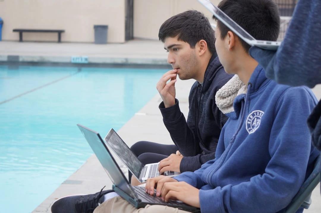 Our software subteam working hard at a pool test