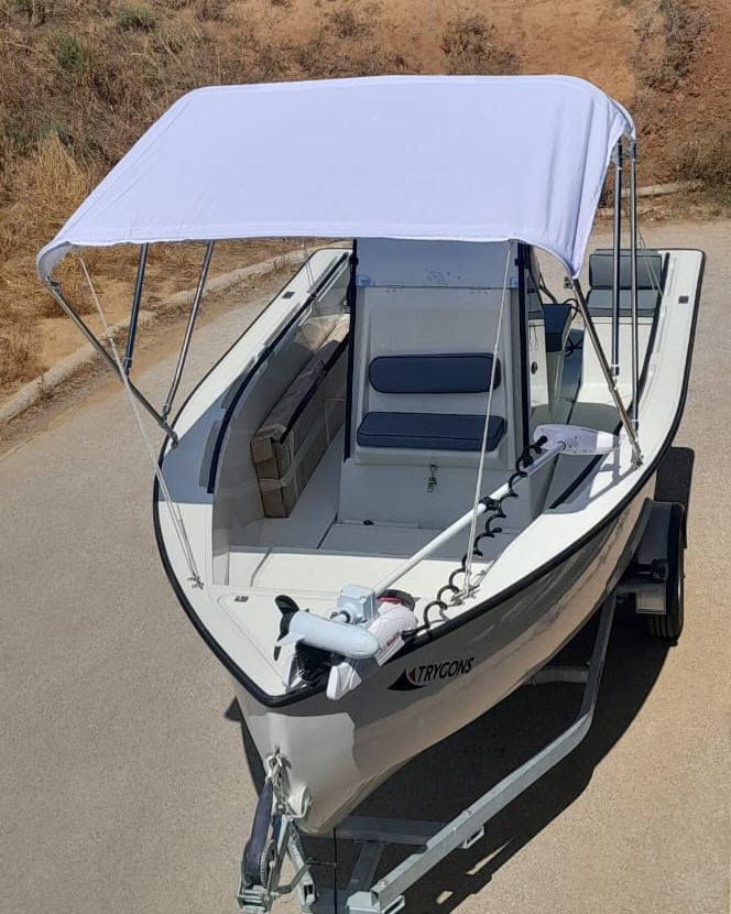 RedFin 50 cockpit from an elevated angle, bimini deployed, non-skid deck