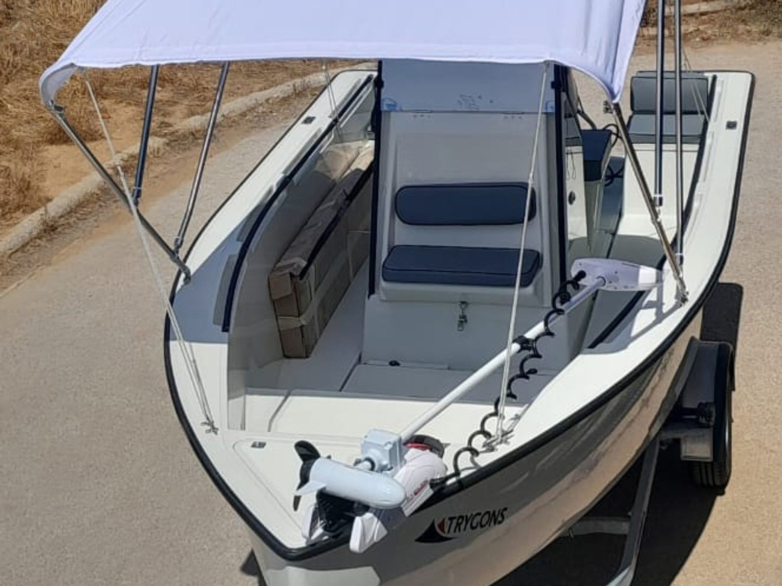 RedFin 50 cockpit from an elevated angle, bimini deployed, non-skid deck