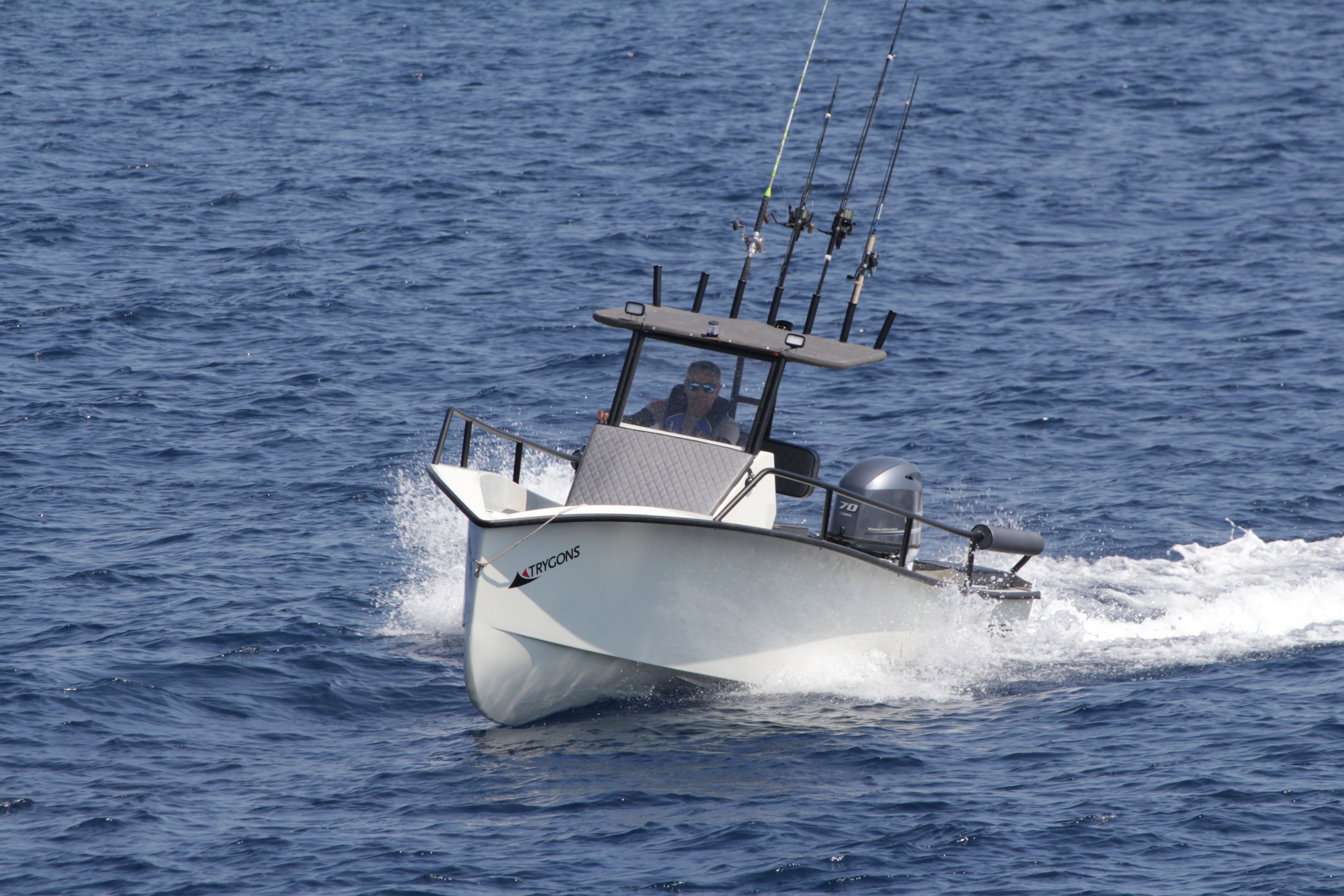 EcoRunner 59 Gen2 running toward the camera, bow wake and spray