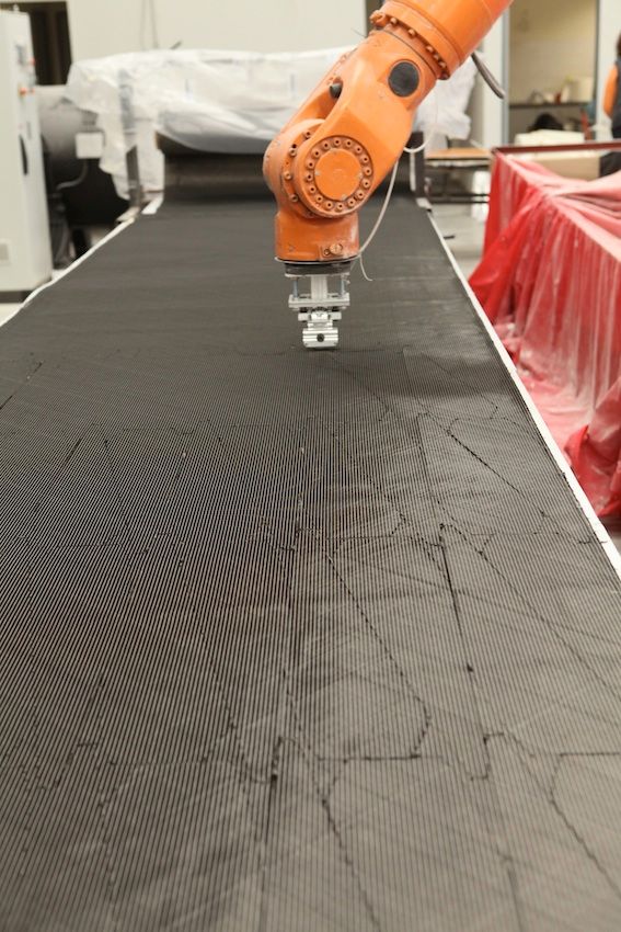 Robotic carbon-fibre ply cutting, TRYGONS composite manufacturing facility