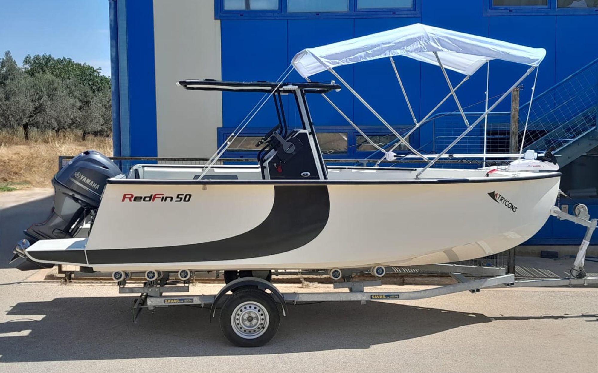 RedFin 50 on its trailer with the bimini deployed, side view