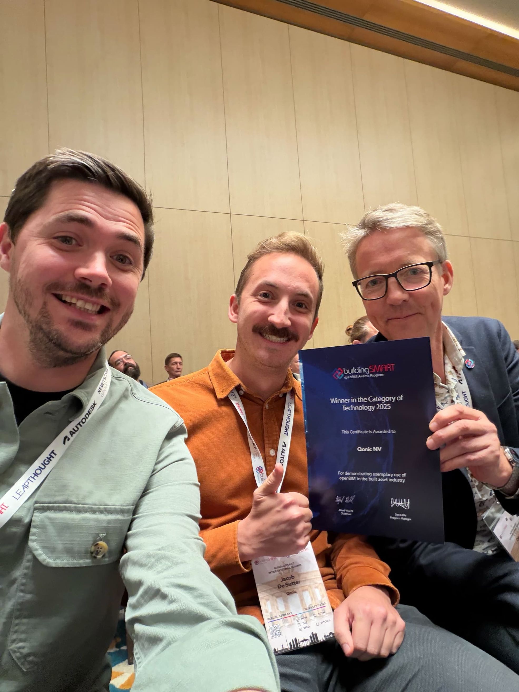 Aaron, Jacob and Dieter proudly holding the BuildingSMART award QI won.