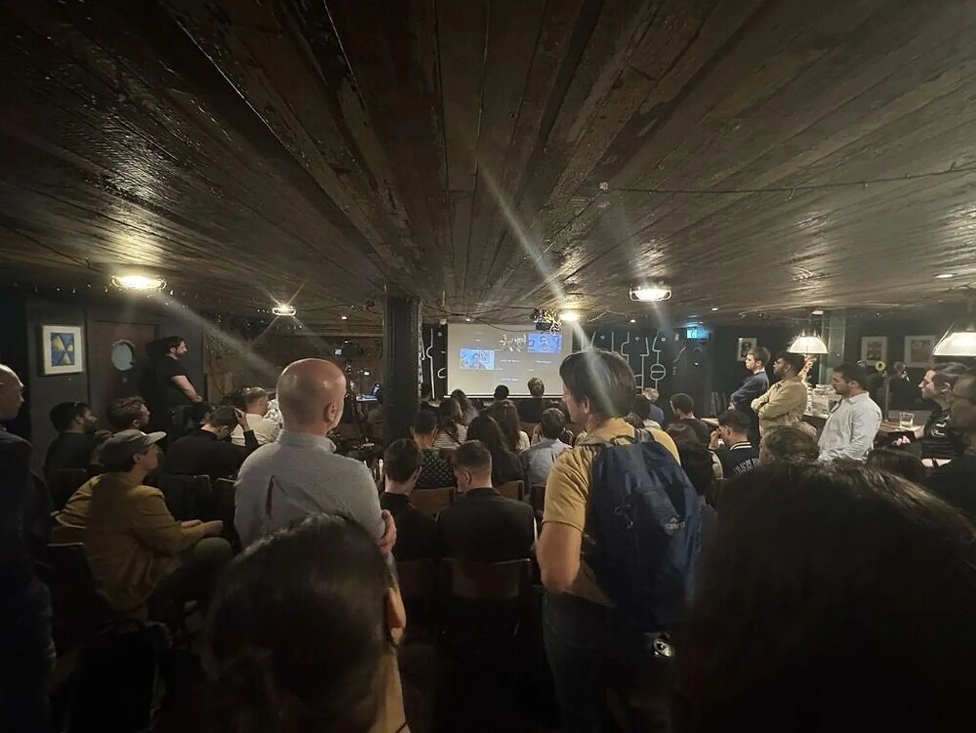 Audience view of the event in the basement.
