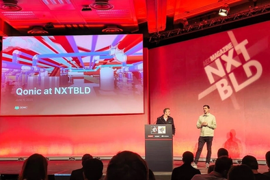 Audience view of Qonic on stage at the NXTBLD event.