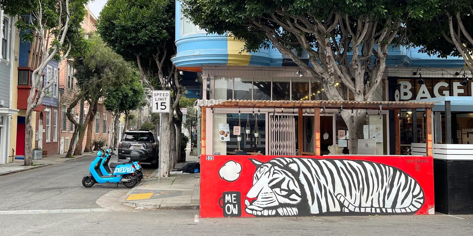 graffiti of a sleeping black and white tiger on a red background