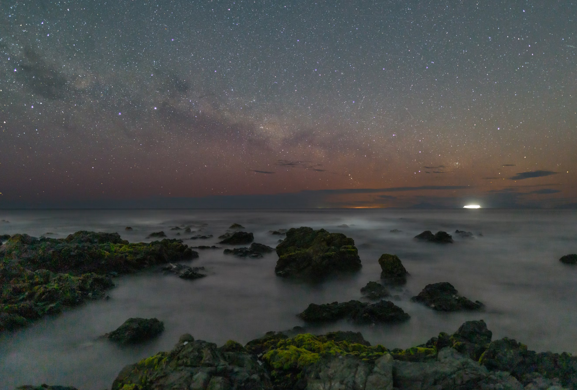 The foggy sea and rocky shore at sunrise using dramatic photography