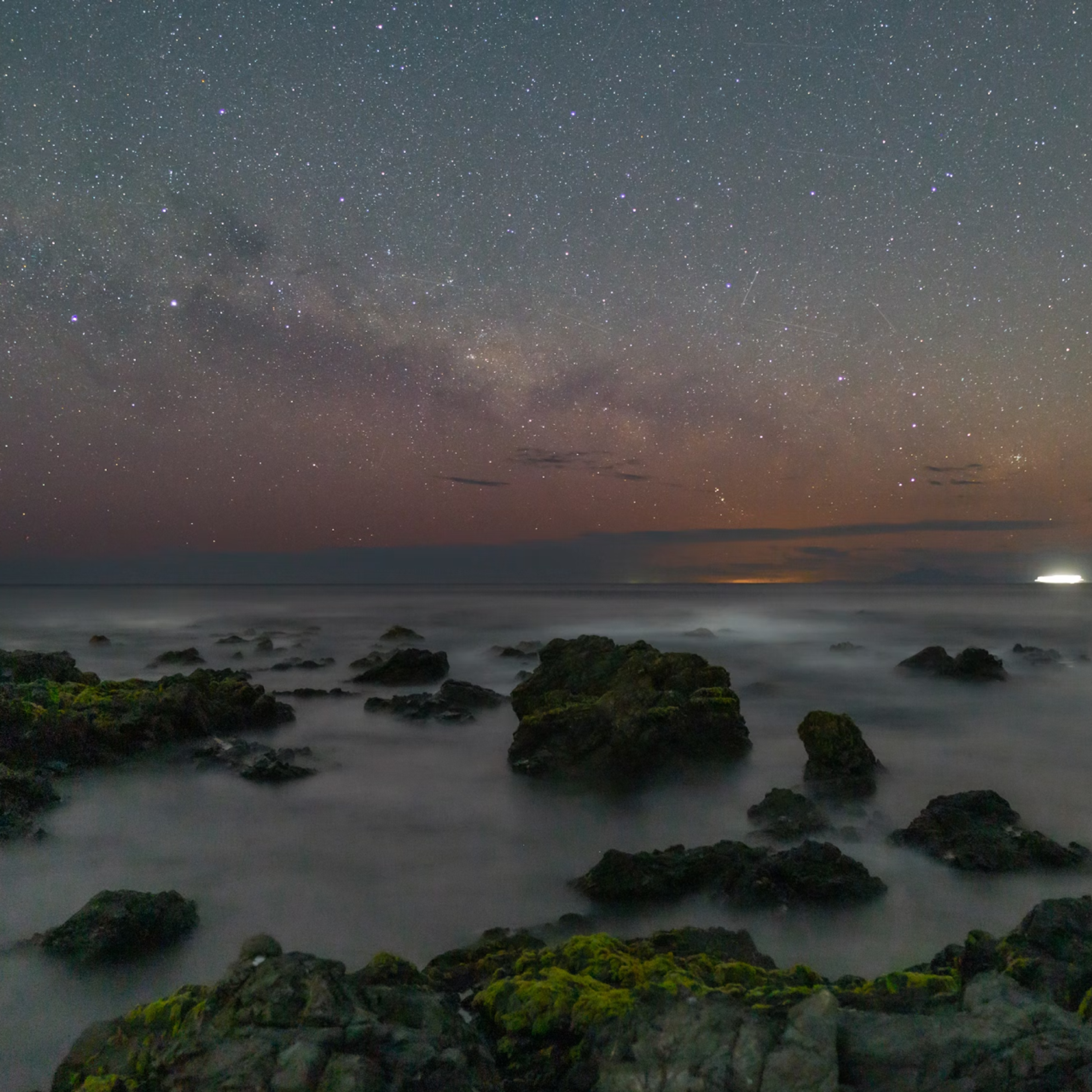 The foggy sea and rocky shore at sunrise using dramatic photography