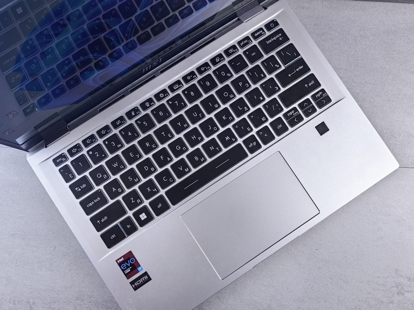 Person typing a Reddit-style discussion post on a laptop