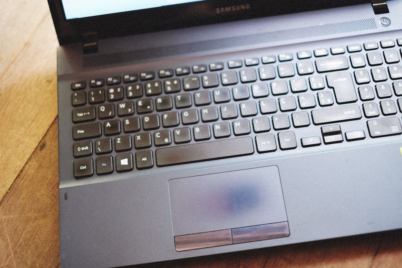 Marketer reviewing a checklist and campaign plan on a laptop
