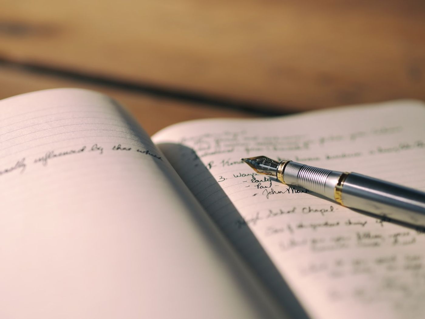 Founder writing notes from a customer interview on a laptop