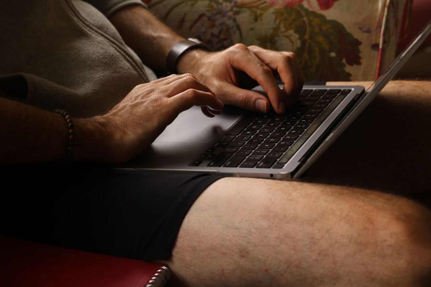Person typing on a laptop in an online community discussion