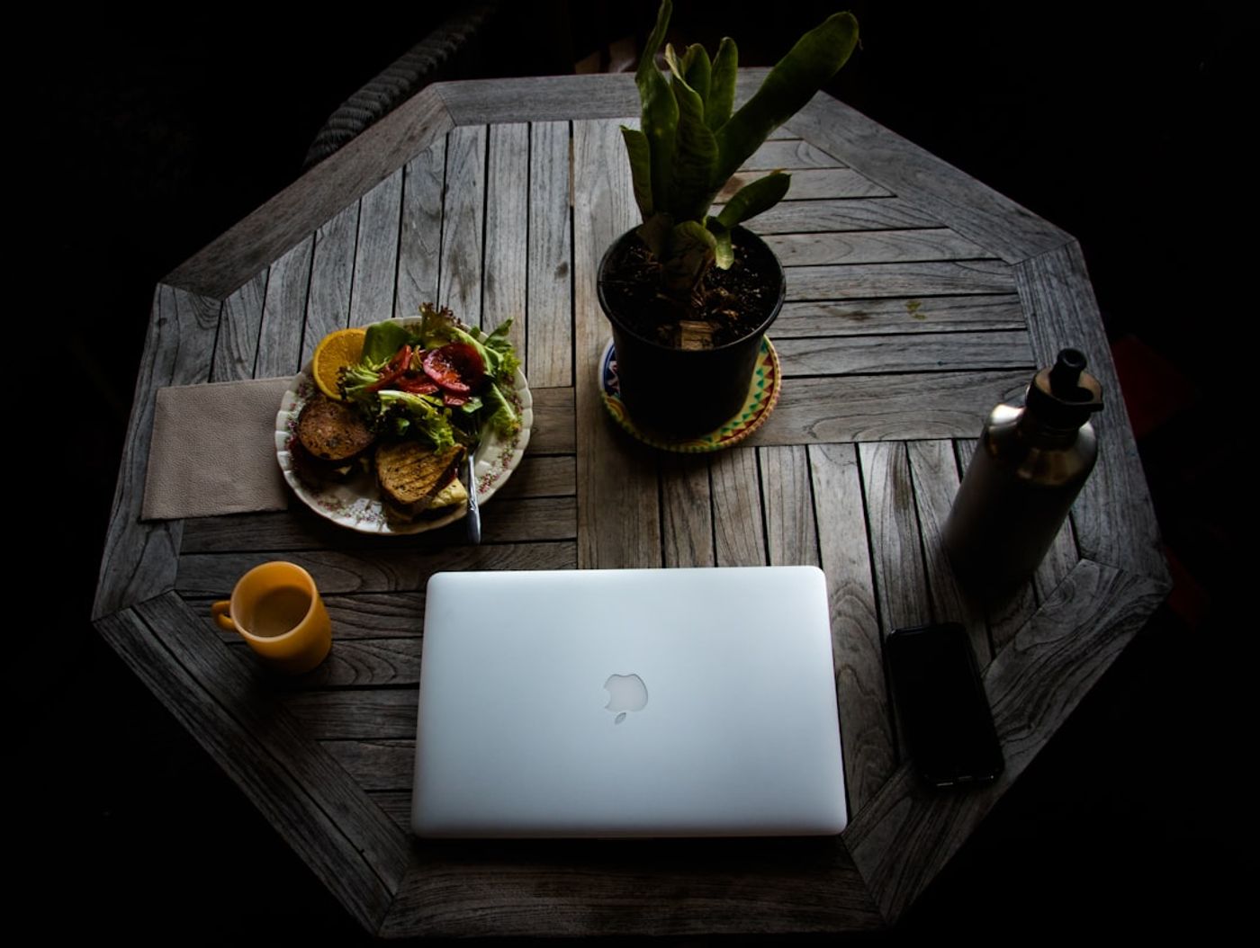 person analyzing community discussion insights on a laptop