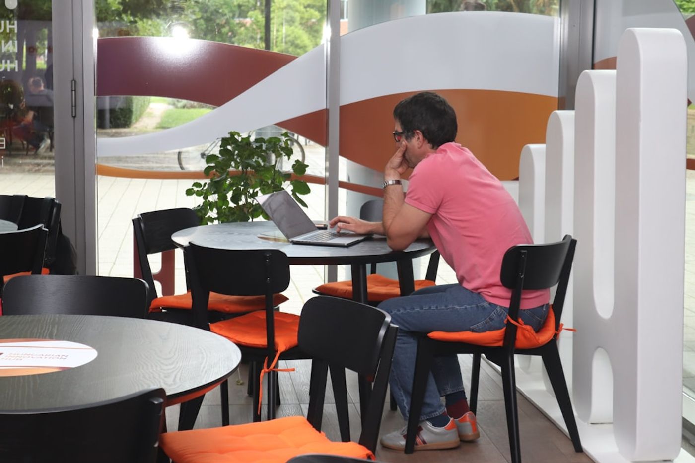 Freelancer outreach planning on a laptop with a simple spreadsheet