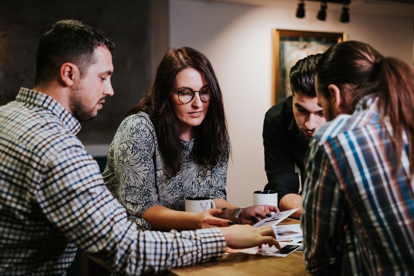 marketing team reviewing campaign metrics on a whiteboard