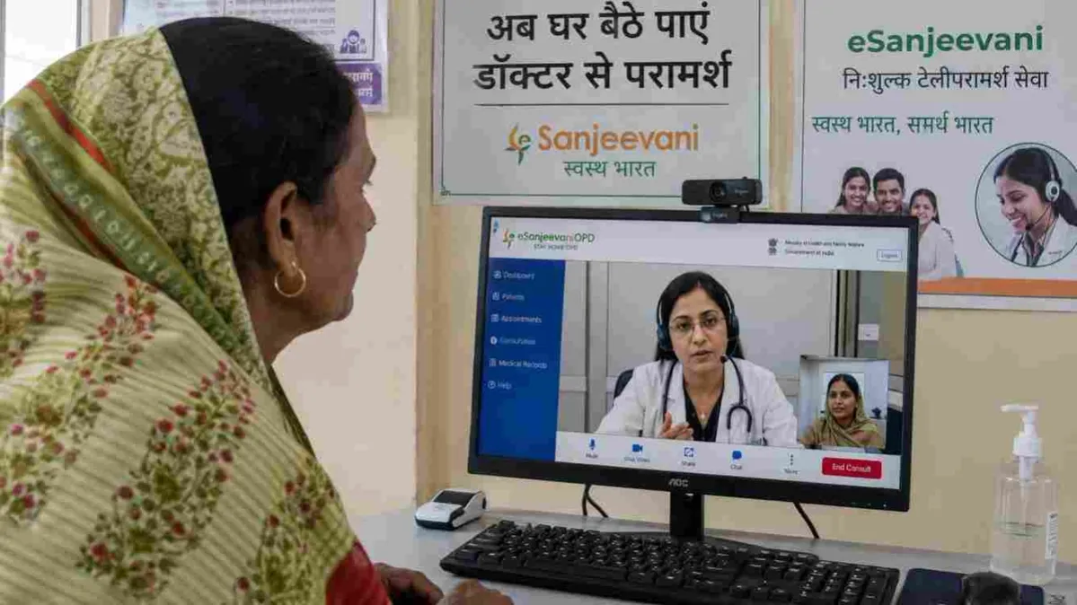 An Indian family using a smartphone to consult a doctor through eSanjeevani from home.