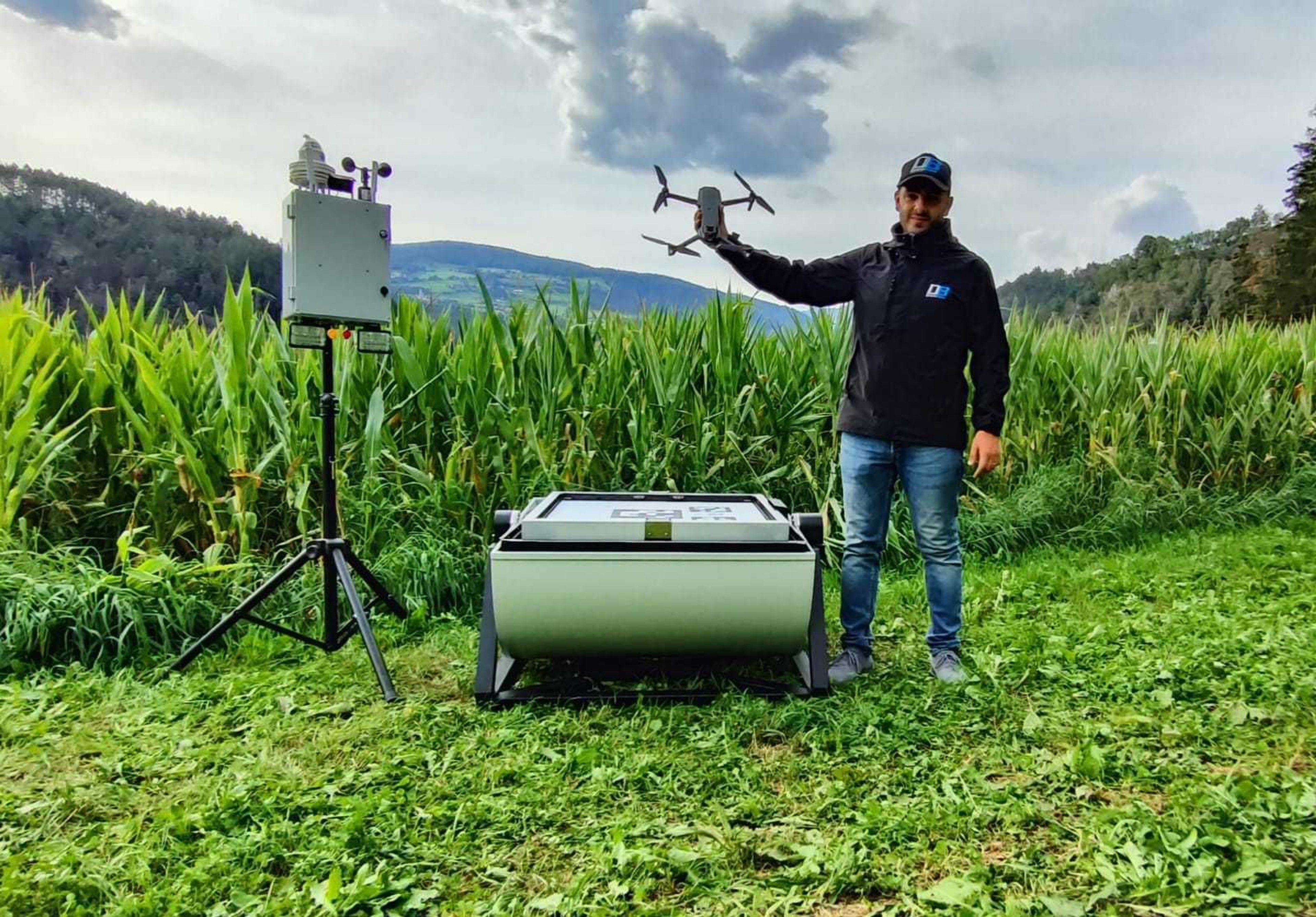 A man standing with a drone and it's dock