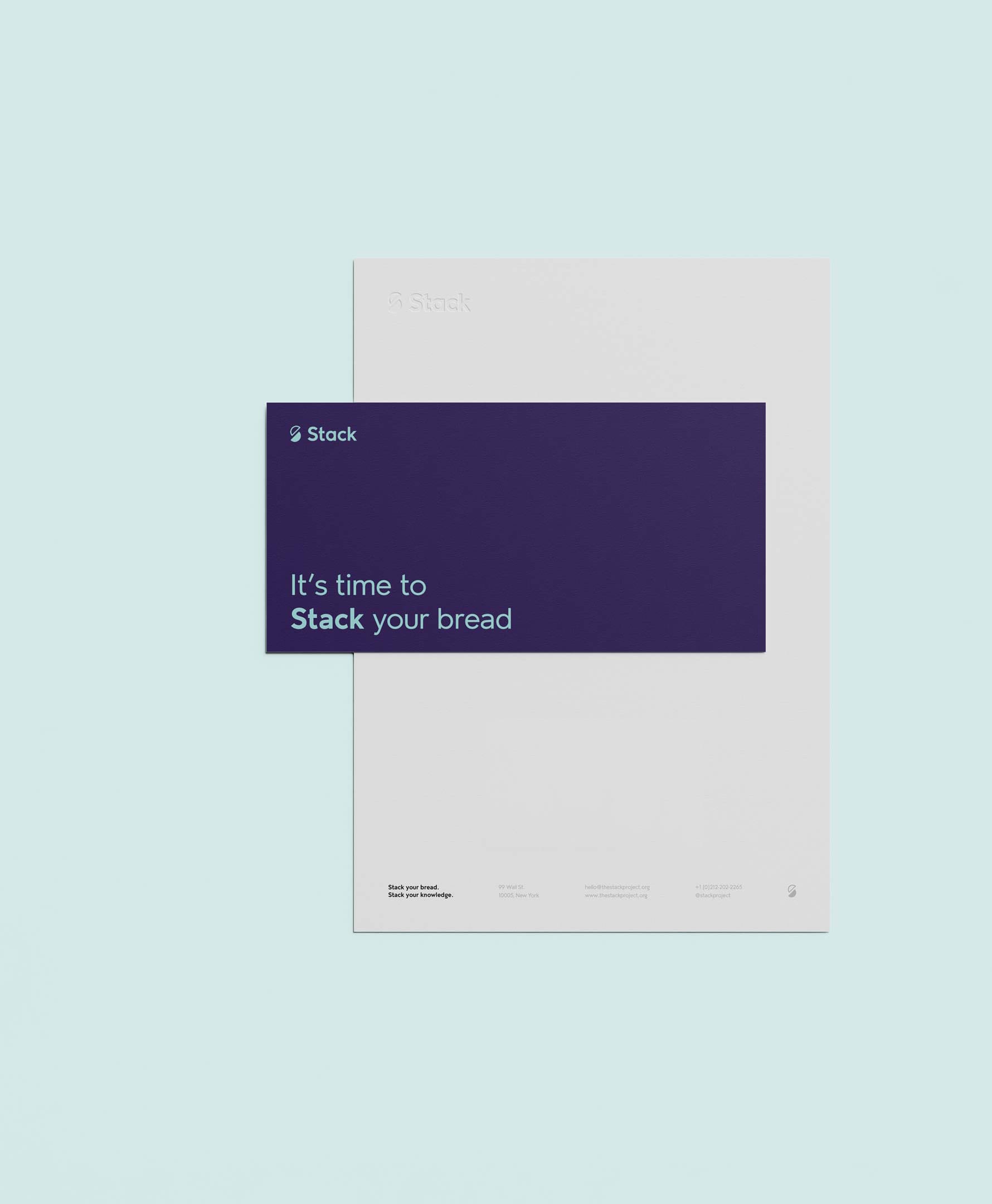 Stack branded letterhead and envelope.
