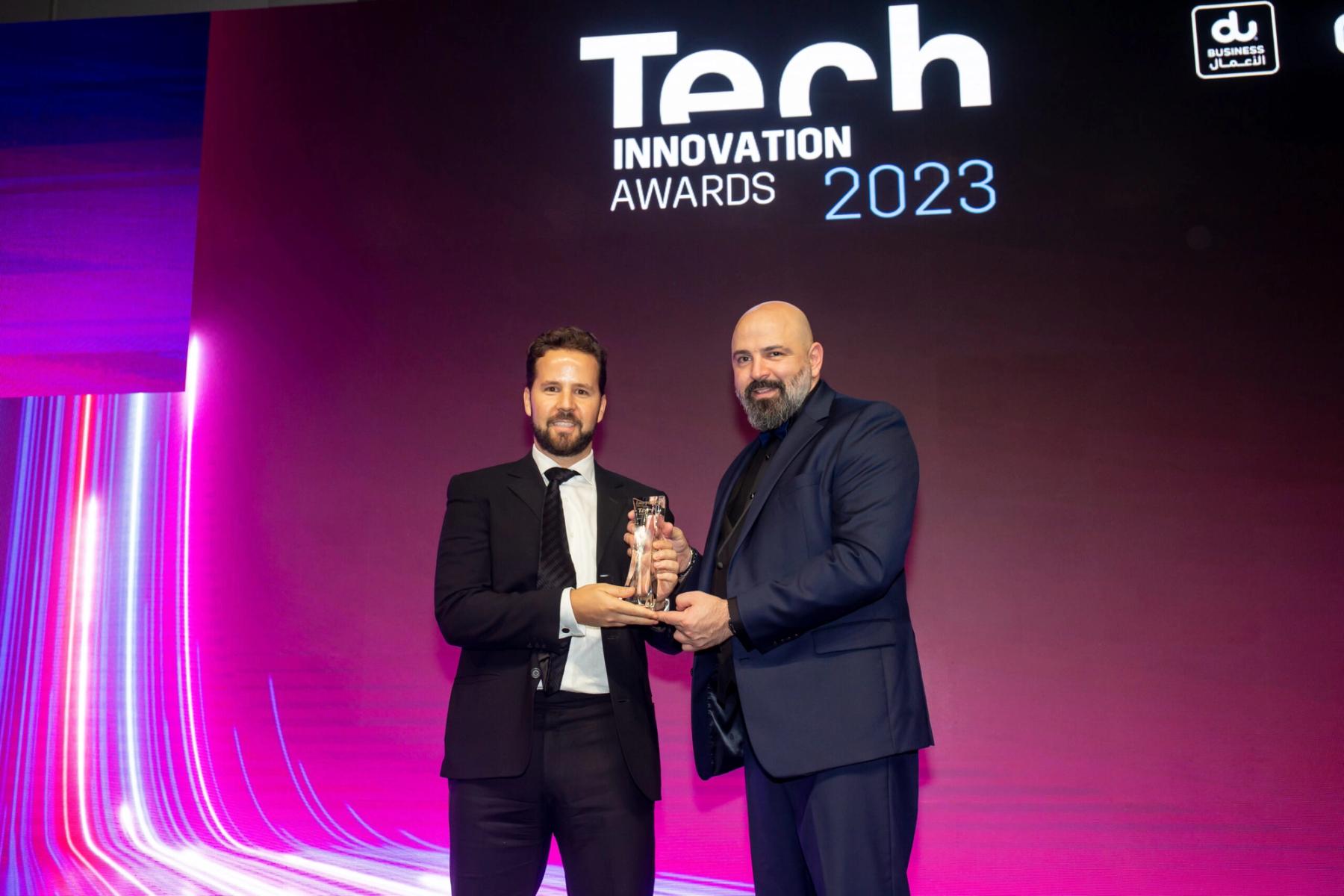 Tembo receiving the Electric Vehicle Innovation of the Year trophy on stage at the Tech Innovation Awards 2023