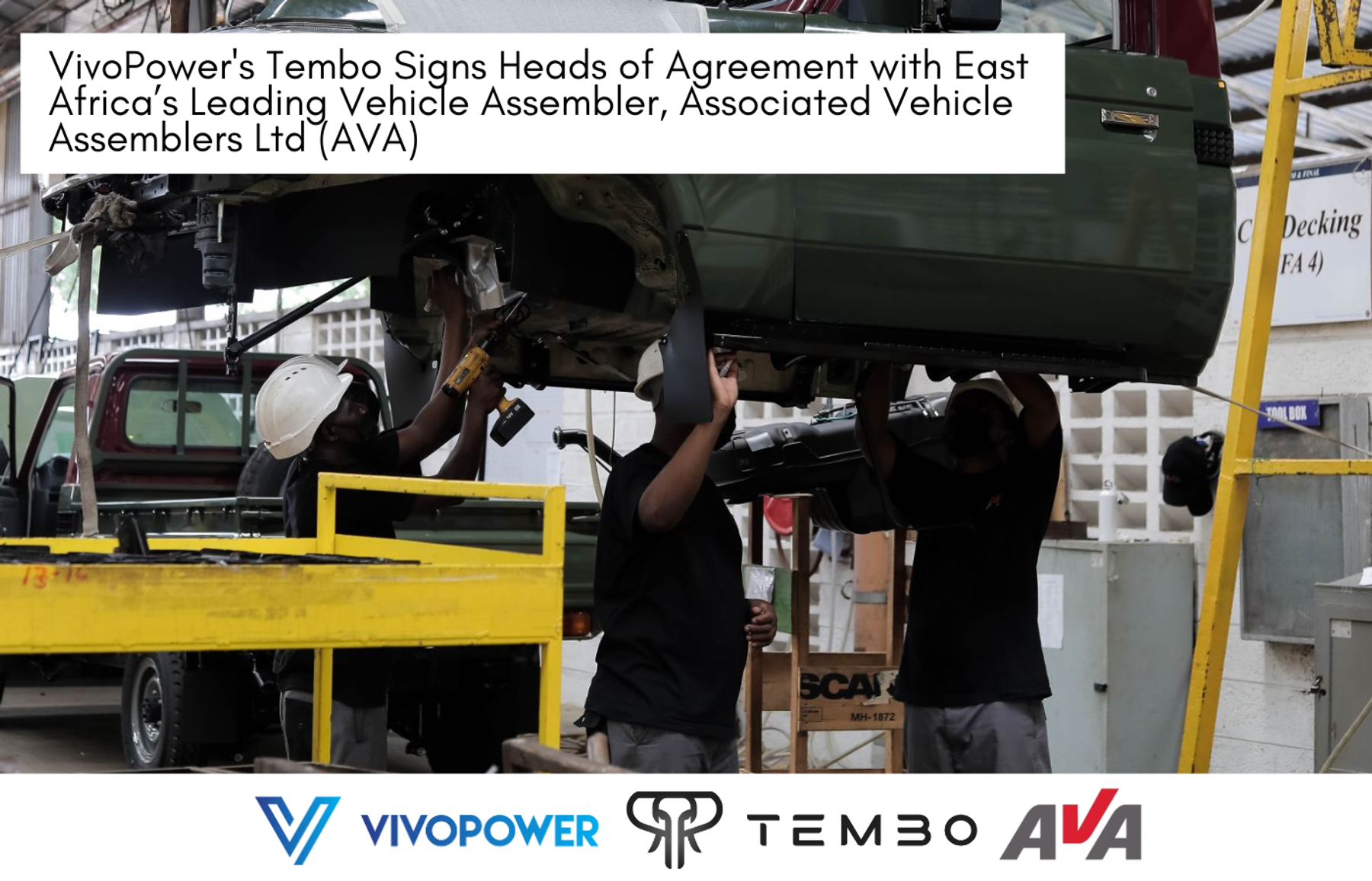 Workers in hard hats fitting parts under a raised vehicle on an assembly line, with VivoPower, Tembo and AVA logos