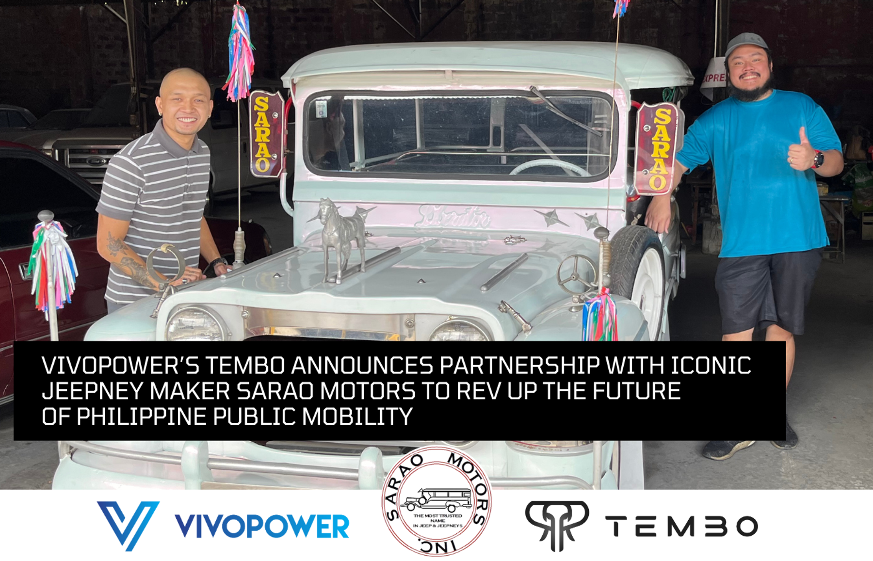 Two men beside a Sarao jeepney with VivoPower, Sarao Motors and Tembo logos announcing their jeepney partnership