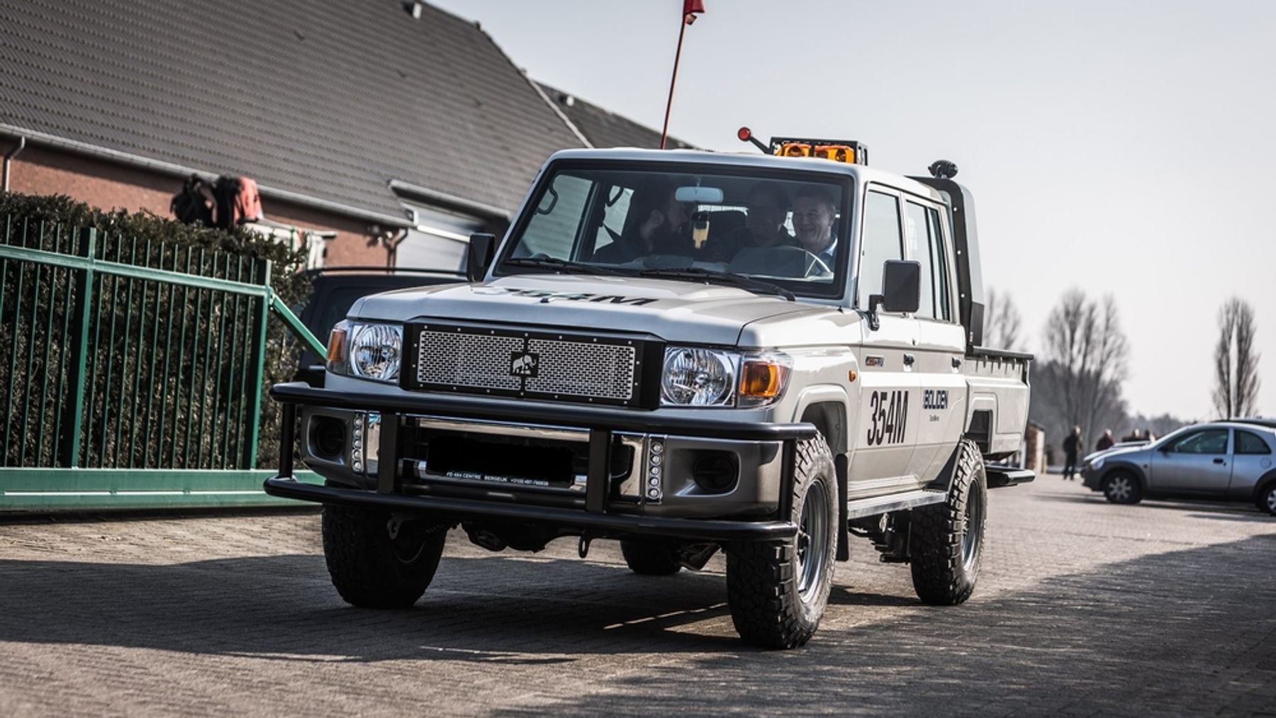 Tembo 4x4 e-LV dual-cab with Boliden decals, roof beacons and safety flag carrying passengers on a launch-day test drive