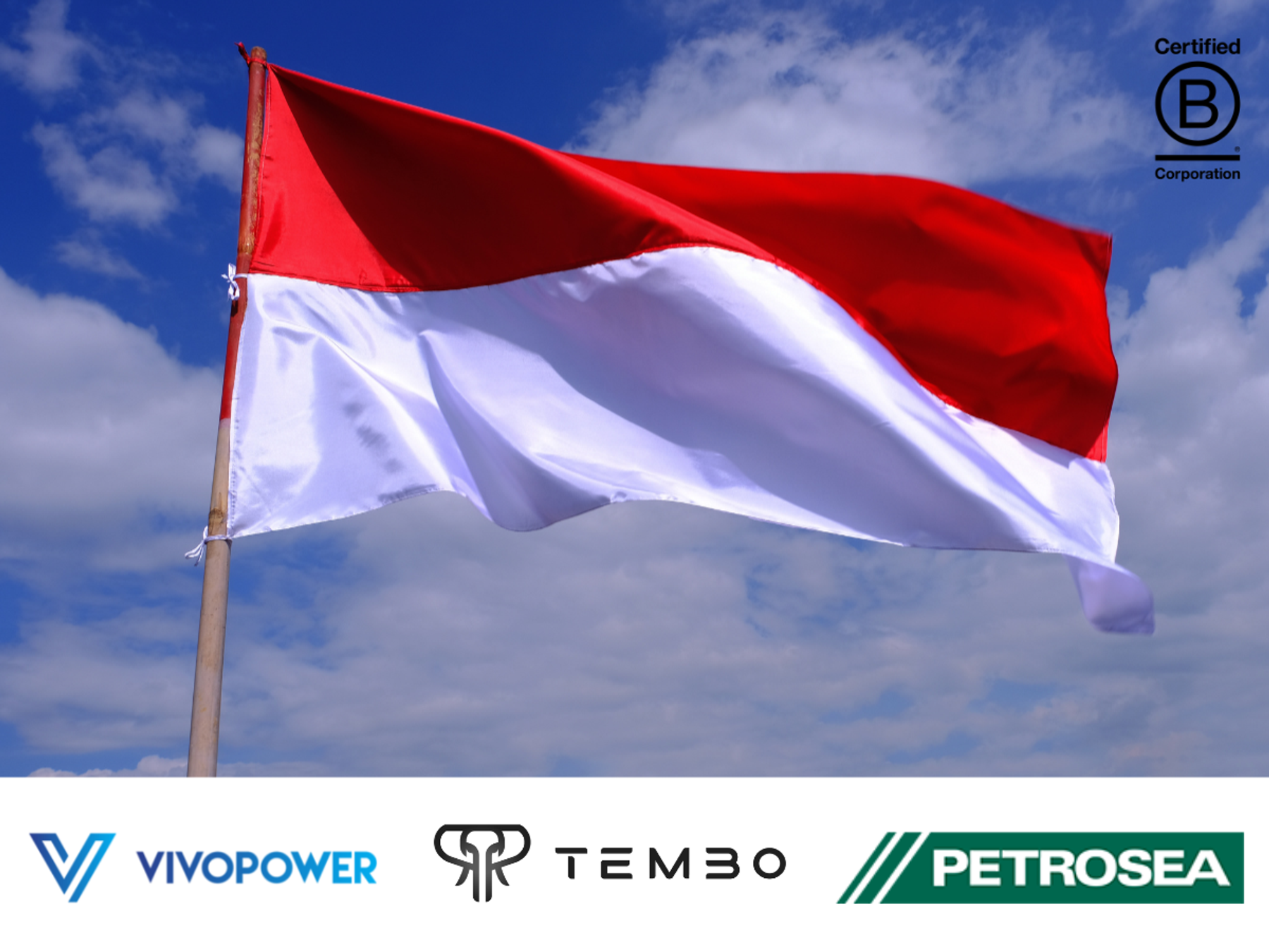 Indonesian flag flying against a blue sky, with VivoPower, Tembo and Petrosea logos