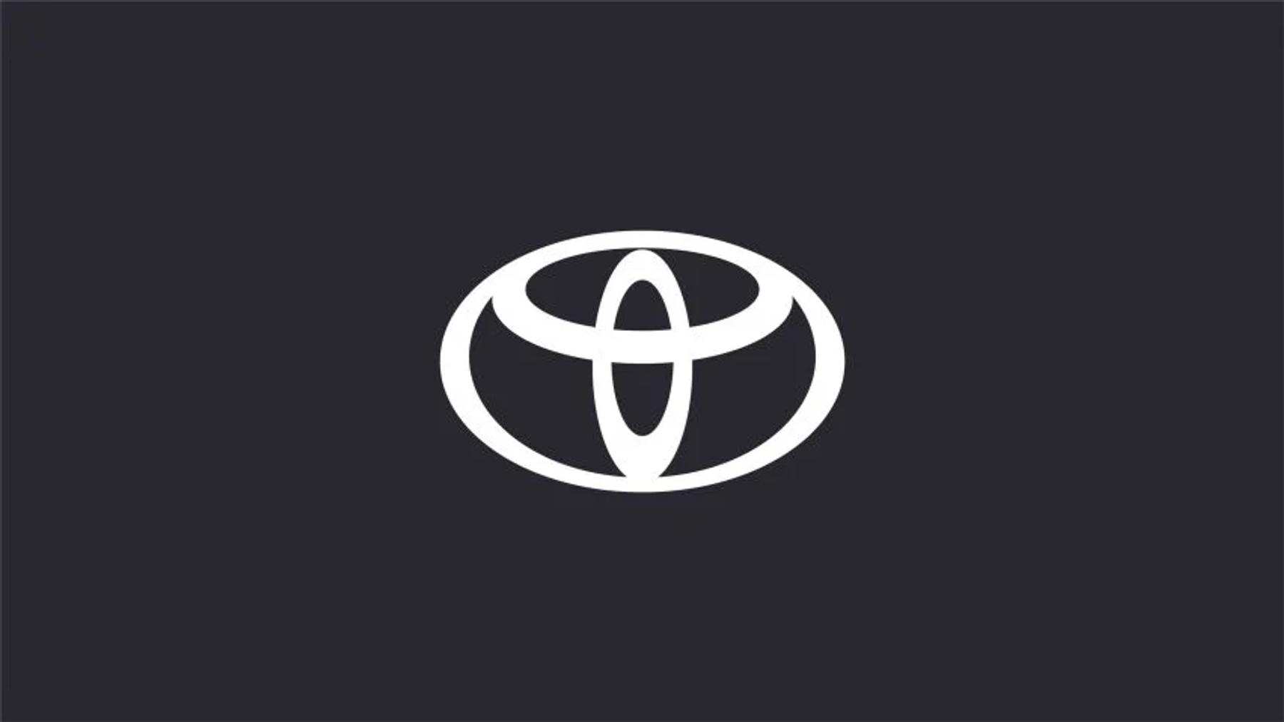 White Toyota emblem on a dark grey background