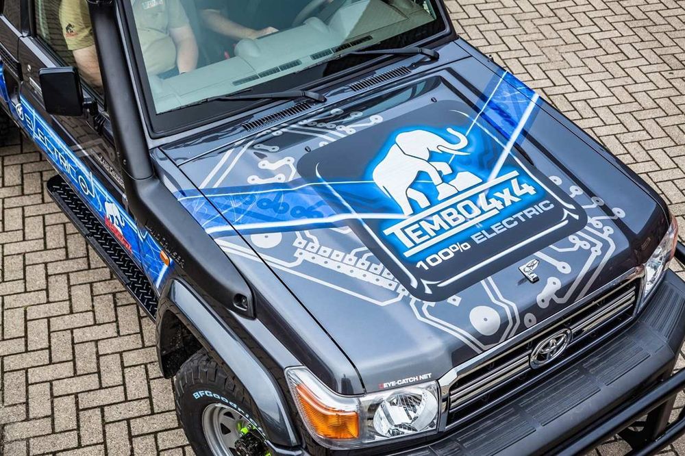 Bonnet of the Tembo 4x4 Electric Cruiser, a Land Cruiser 70 series with blue circuit-board livery and a 100% electric logo