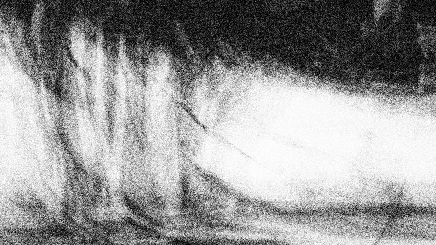 Abstract texture of blurred charcoal lines.