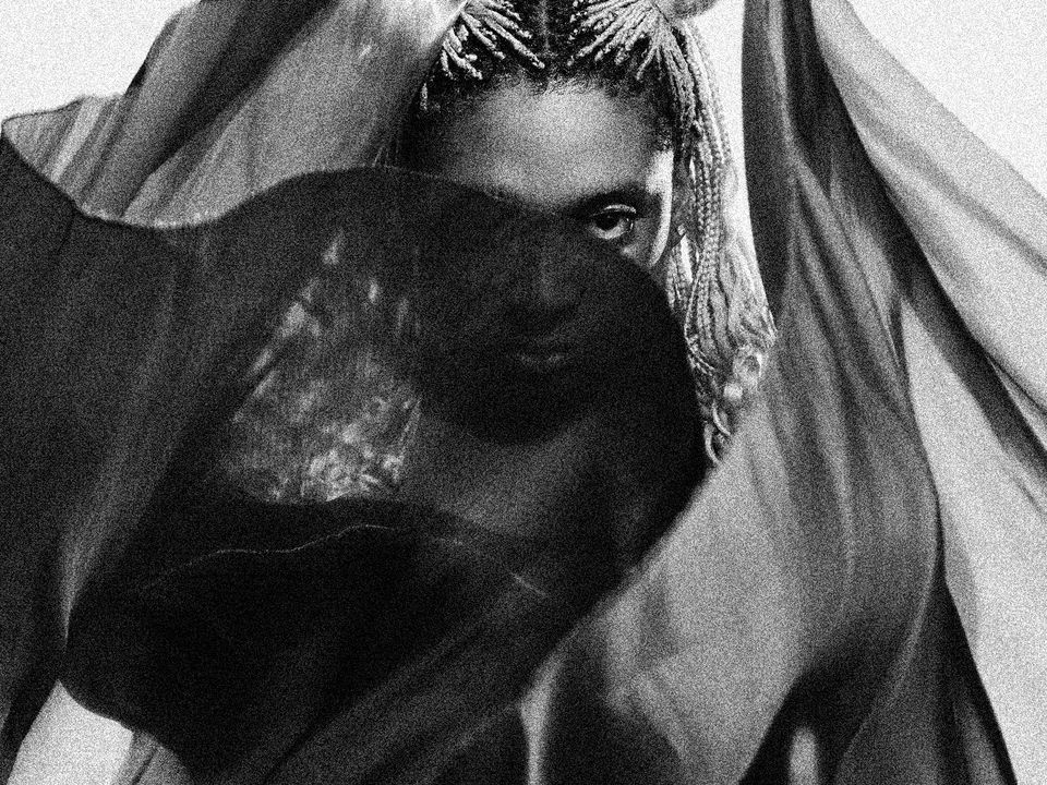 Lotic poses shrouded by waving materials.