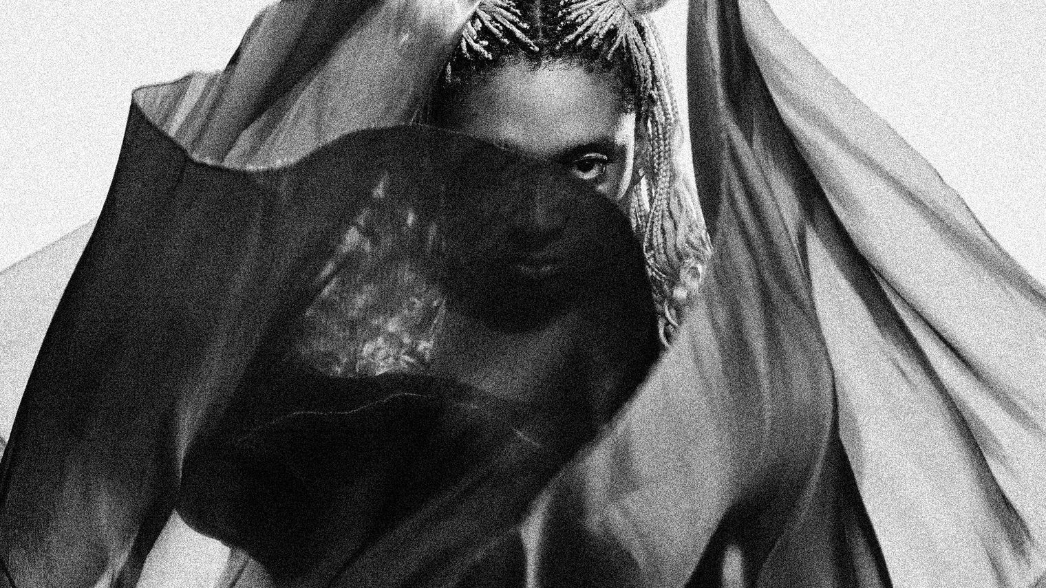 Lotic shrouded in flowing fabric.