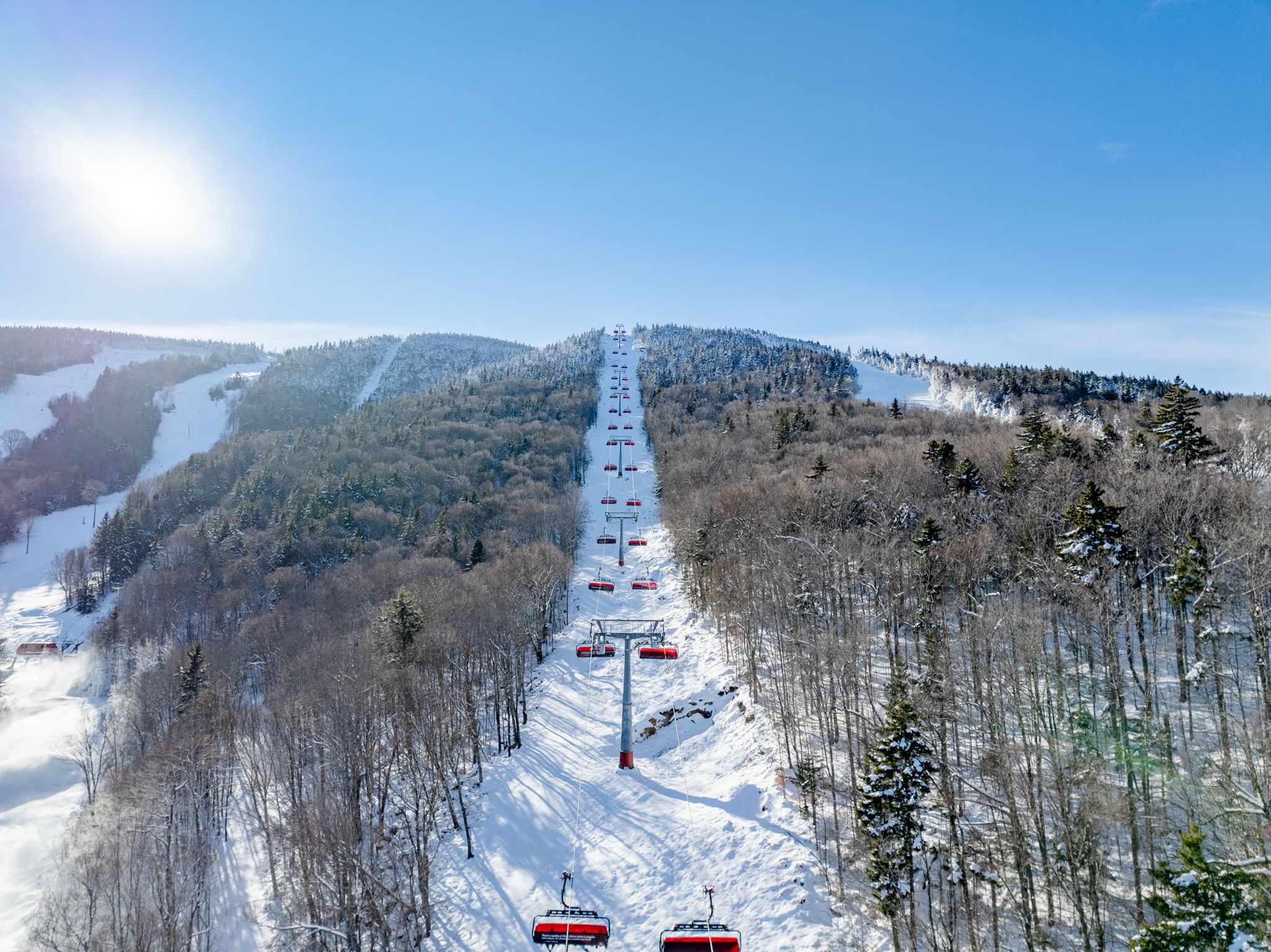 Sunday River's Jordan 8 chairlift on a bluebird winter day