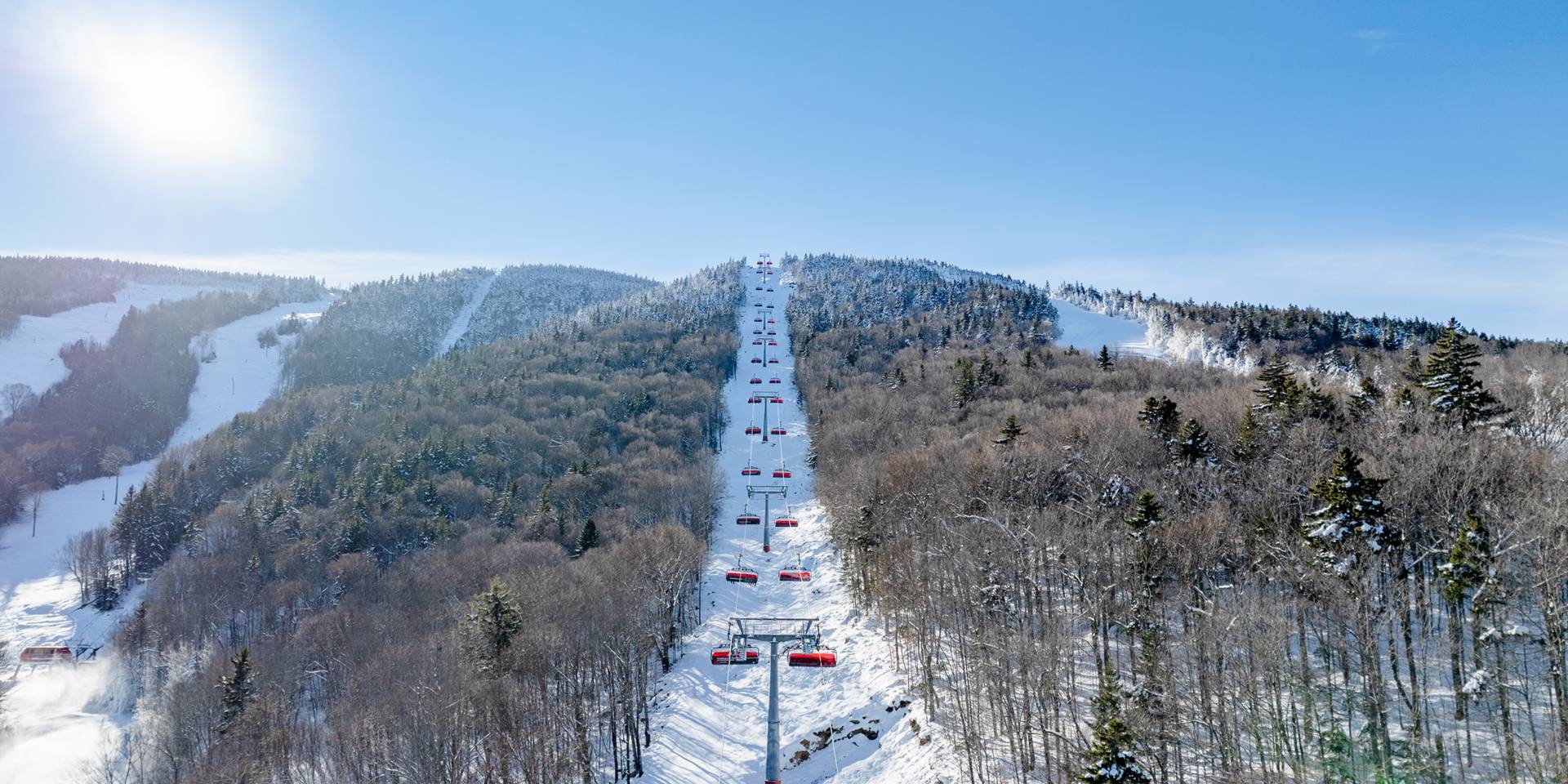 Sunday River's Jordan 8 chairlift on a bluebird winter day
