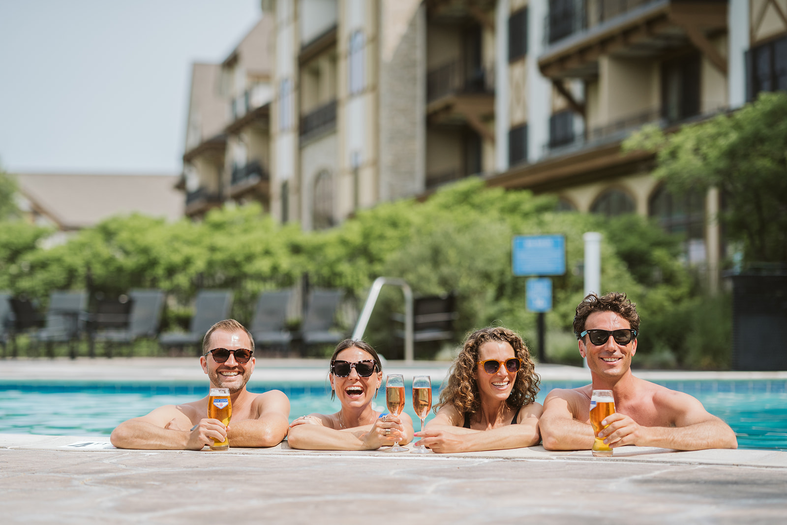 Four friends at the pool at Boyne Mountain