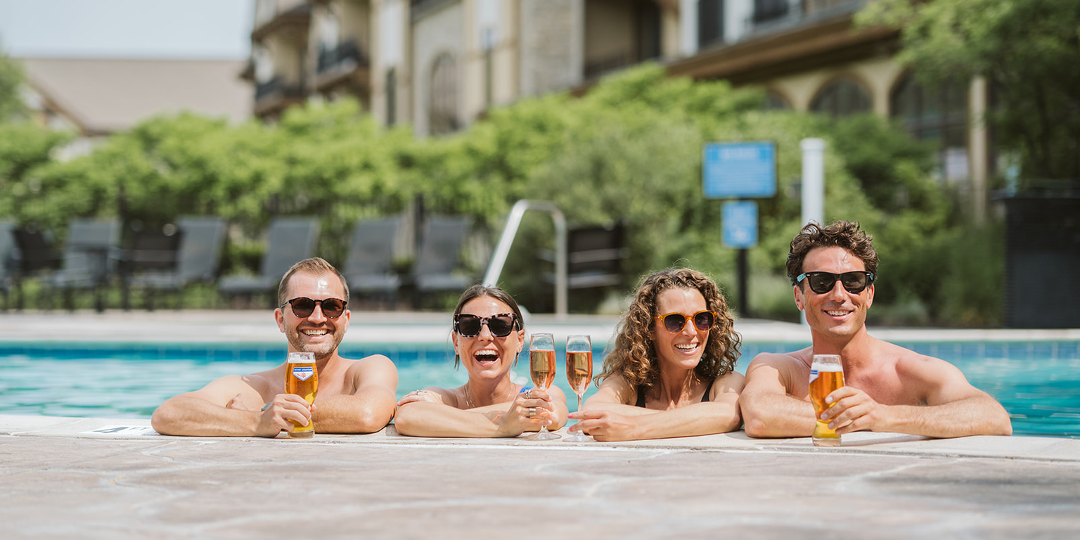 Four friends at the pool at Boyne Mountain