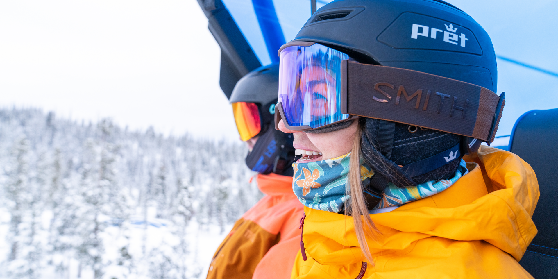 Two Skiers on the bubble chair at Big Sky Resort