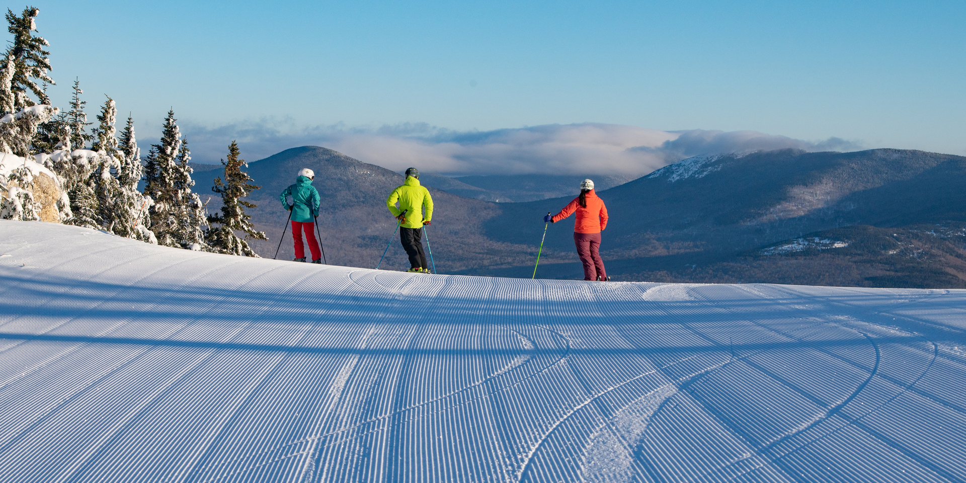 Perfect Corduroy and 3 Skiers Enjoy a Scenic View